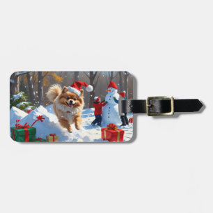 Pomeranian Rent in de Sneeuw met Kerstmuts Bagagelabel