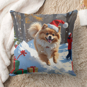 Pomeranian Rent in de Sneeuw met Kerstmuts Kussen