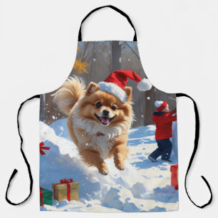 Pomeranian Rent in de Sneeuw met Kerstmuts Schort