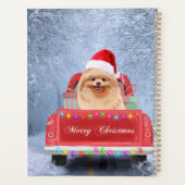 Pommeraanse hond op sneeuw in kerstmis planner (Achterkant)