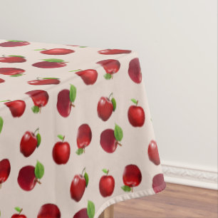 Pommes rouges sur nappe beige clair