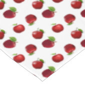 Pommes rouges sur nappe blanche (Angle)