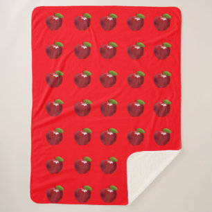 Pommes sur la couverture rouge Sherpa
