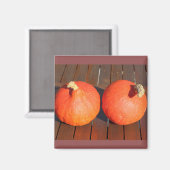 Pompoenen op een houten tafel magneet (Voorkant / Achterkant)