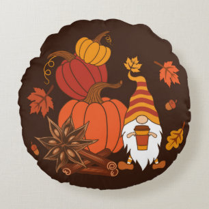 Pompoenen, steranijs, kaneelstokjes, herfstlev rond kussen