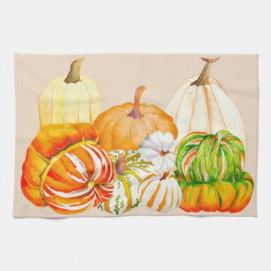 Pompoenoogst op een keukenhanddoek