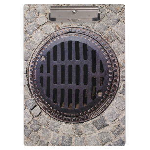 Porte-bloc Couverture de trou d'homme et route de pavé rond