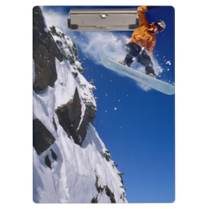 Porte-bloc Homme sur un snowboard sautant d'une corniche à