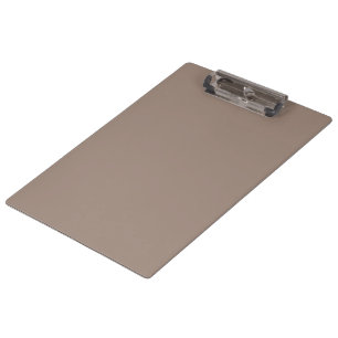 Porte-bloc un mur marron avec une horloge