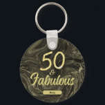 Porte-clés 50 and Fabulous Black Gold 50th Birthday<br><div class="desc">Celebrate a 50th birthday with this custom name black and gold 50 and Fabulous keychain. It has an elegant, modern chic design with abstract marble swirl in black and gold. The fancy typography is partly in a gold glitter script. Also, you can easily personalize this keychain by changing the name...</div>