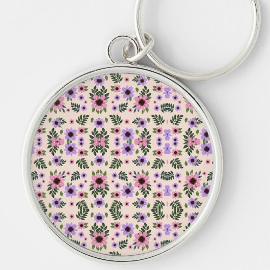 Porte-clés A round keychain featuring a vibrant floral (Devant)