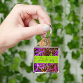 Porte-clés à tourbillons violet néon et vert avec  (main)