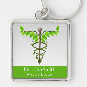 Porte-clés Alternative Médicale Caduceus Vert Feuilles Blanc