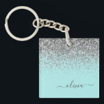 Porte-clés Aqua bleu Turquoise Parties scintillant argent Mon<br><div class="desc">Aqua Blue - Turquoise et Argent Faux Foil Parties scintillant étincelante Script Monogramme Nom Porte - clé. Cela rend le cadeau parfait pour 16 ans,  mariage,  douche nuptiale,  anniversaire,  baby shower ou bachelorette pour quelqu'un qui aime le luxe glam et les styles chic.</div>