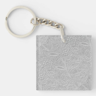 Porte-clés Aspect floral embossé gris