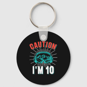 Porte-clés Attention 10 ski 10e anniversaire snowboard 10 ans