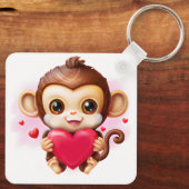 Porte-clés Bébé adorable singe tenant un coeur rouge (Verso)