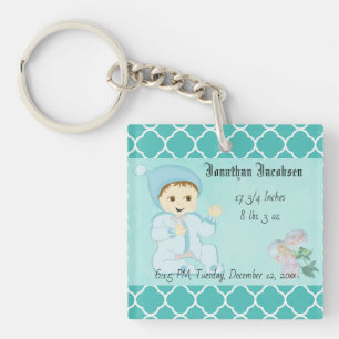Porte-clés Bébé bébé garçon en bleu avec fleurs