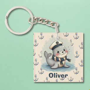 Porte-clés Bébé phoque mignon avec chapeau et écharpe de mari