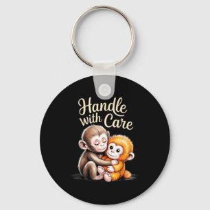 Porte-clés Bébé singe coup de poing