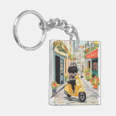 Porte-clés Black Doodle Riding Scooter European City Streets (Devant gauche)