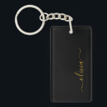 Porte-clés Black Gold Modern Script Girl Monogramme Nom<br><div class="desc">Noir et or Simple Script Monogramme Nom Porte - clé. Cela rend le cadeau parfait pour 16 ans,  mariage,  douche nuptiale,  anniversaire,  baby shower ou bachelorette pour quelqu'un qui aime le luxe glam et les styles chic.</div>