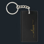 Porte-clés Black Gold Modern Script Girl Monogramme Nom<br><div class="desc">Noir et or Simple Script Monogramme Nom Porte - clé. Cela rend le cadeau parfait pour 16 ans,  mariage,  douche nuptiale,  anniversaire,  baby shower ou bachelorette pour quelqu'un qui aime le luxe glam et les styles chic.</div>