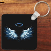 Porte-clés Blue Glowing Angel Wings on black background (Verso)