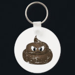 Porte-clés Boucle de ceinture en plastique en colère<br><div class="desc">Un dessin d'un caca en colère. Caractère de dessin avec effet déprimé.</div>