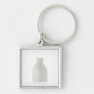 Porte-clés Bouteille à lait sur l'arrière - plan blanc