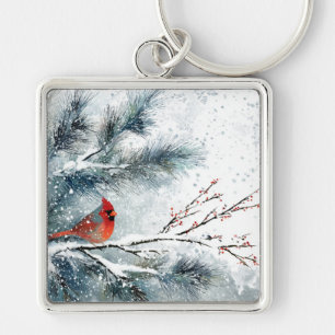 Porte-clés Cardinal rouge sur branche de pin enneigée