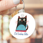 Porte-clés Cat Ladies Vote Script Rustique Bold mignon Patrio<br><div class="desc">"Les femmes de chat votent". Soyez fiers et partagez votre soutien à Kamala Harris avec ce porte - clé mignon, amusant, graphique et patriotique. Une jolie illustration de chat rustique en noir, rouge, blanc et turquoise bleu et bleu marine manuscrite typographie recouvre un arrière - plan blanc. Choisissez des tailles...</div>