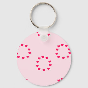 Porte-clés cercles de coeur rouge sur rose