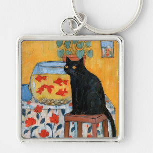 Porte-clés Chat noir curieux regardant un aquarium