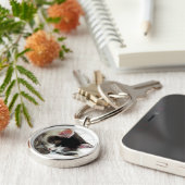 Porte-clés Chaton endormi sur l'édredon blanc (Côté)