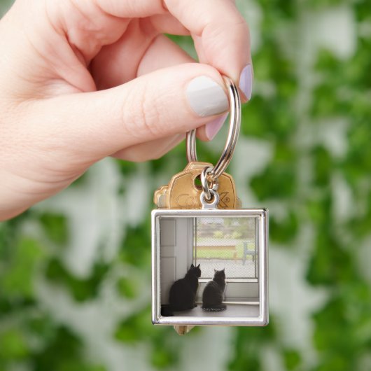 Porte-clés Chats regardant la porte grillagée (main)