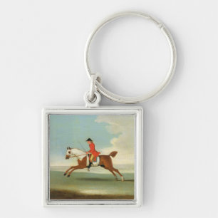 Porte-clés Cheval de course galopant et jockey monté en roug