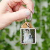 Porte-clés Chien avec la laisse dans la bouche (main)