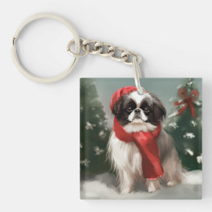 Porte-clés Chien Japonais Chin dans la neige de Noël