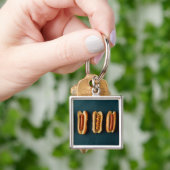 Porte-clés Chiens chauds et fusils (main)