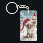 Porte-clés Chihuahua Winter Wonderland Christmas Joy<br><div class="desc">Ce design festif reflète l'esprit joyeux de la période des fêtes, avec un adorable petit portant un chapeau de Père Noël. Le chien est niché dans un pays des merveilles hivernales, avec un bonhomme de neige, un sapin de Noël décoré et des cadeaux joliment emballés. Les flocons de neige tombent...</div>