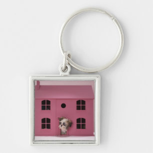 Porte-clés Chiot scrutant hors de la maison de poupée