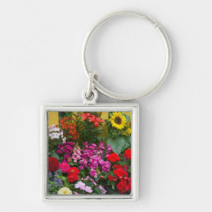 Porte-clés Clôture blanche avec jardin de fleurs en