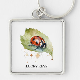Porte-clés Coccinelle chanceuse sur une feuille
