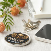 Porte-clés Conception de crâne et d'ailes dorés (Côté)