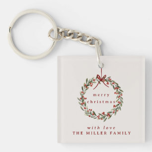 Porte-clés Couronne feuillage de Noël avec arc rouge.