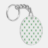 Porte-clés Croix verte coutures sur blanc (Devant gauche)