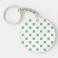 Croix verte coutures sur blanc
