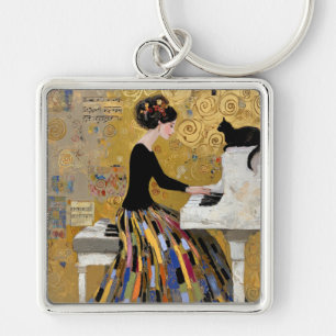 Porte-clés Dame au piano de Klimt en or avec chat noir