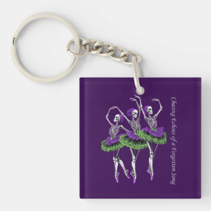 Porte-clés Danseuse squelette violet vert Poursuivant les éch